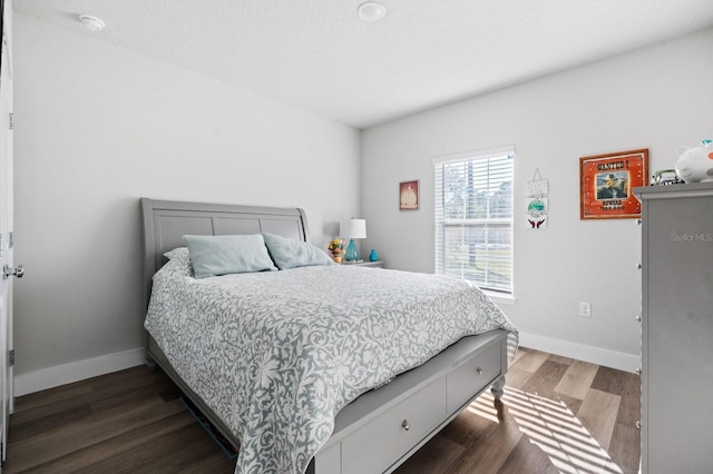 bedroom featuring dark hardwood / wood-style floors