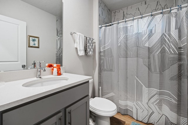 bathroom featuring hardwood / wood-style floors, vanity, toilet, and a shower with curtain