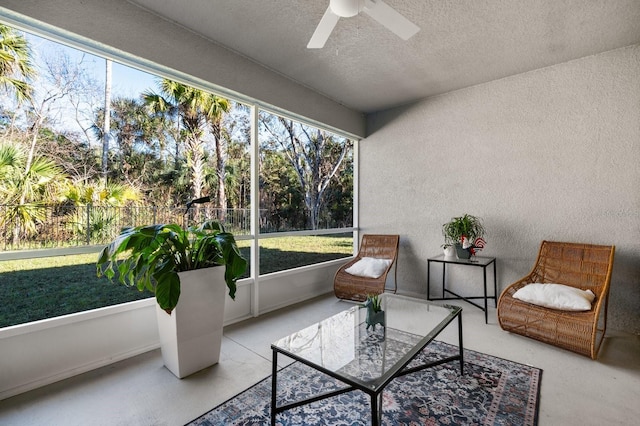 sunroom with ceiling fan