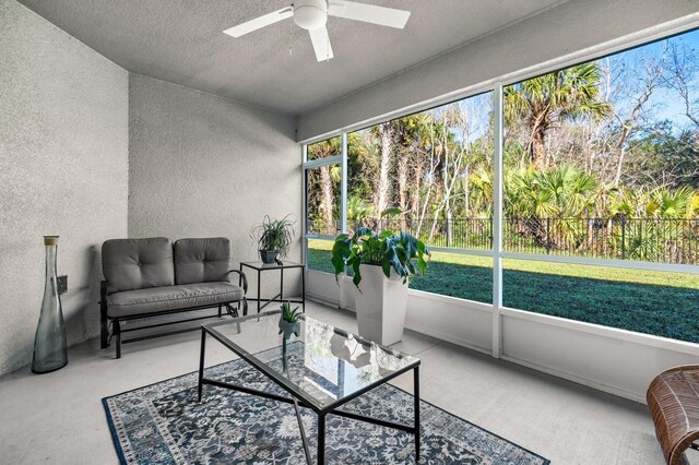 sunroom with ceiling fan