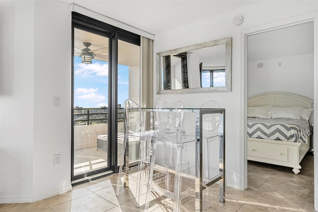 bedroom featuring floor to ceiling windows, access to exterior, and multiple windows