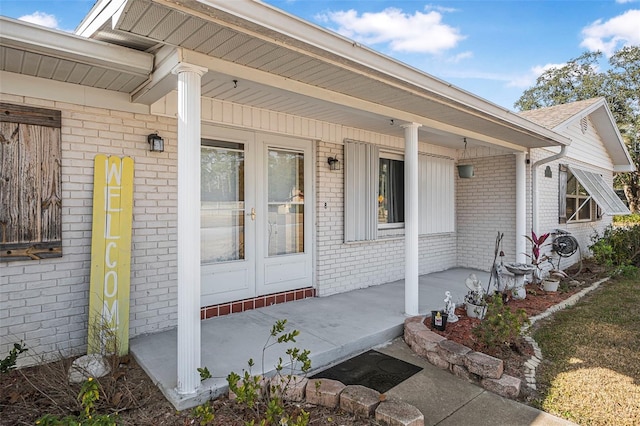 doorway to property with french doors and a porch