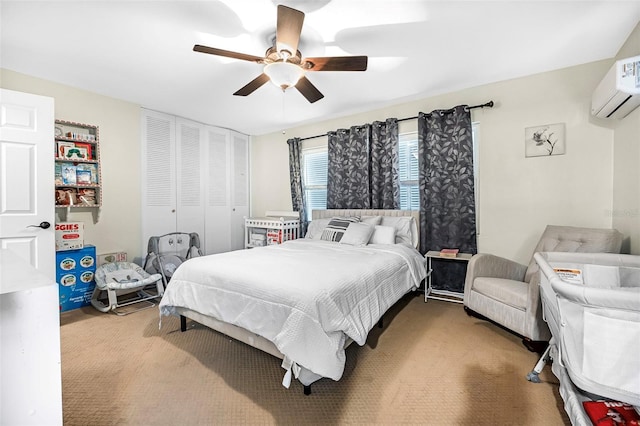 bedroom with ceiling fan, a closet, and a wall mounted air conditioner