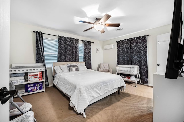 carpeted bedroom featuring ceiling fan and a wall unit AC