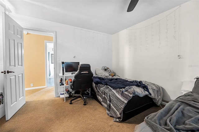 bedroom with ceiling fan and light colored carpet