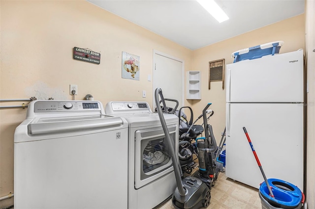 laundry area with washer and clothes dryer