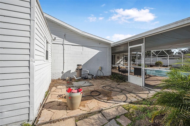 view of patio with a lanai and a sunroom