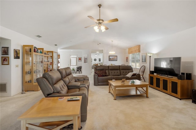 living room featuring ceiling fan, light colored carpet, and lofted ceiling