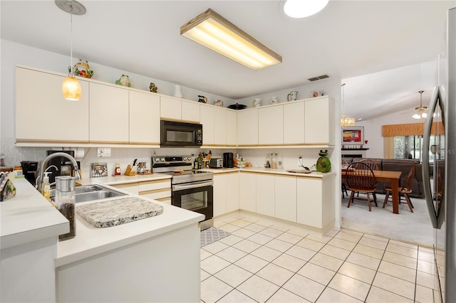 kitchen featuring ceiling fan, sink, hanging light fixtures, lofted ceiling, and appliances with stainless steel finishes