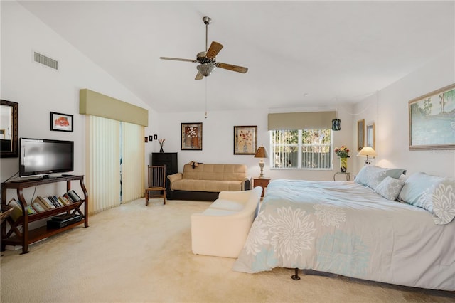 bedroom with carpet, ceiling fan, and vaulted ceiling