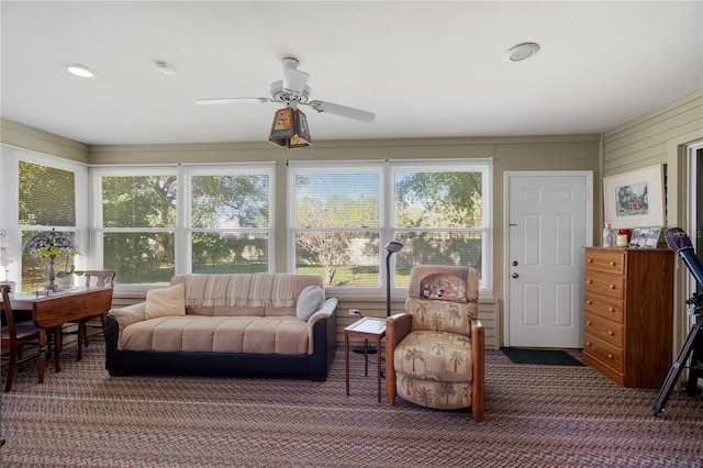 sunroom featuring ceiling fan and a healthy amount of sunlight