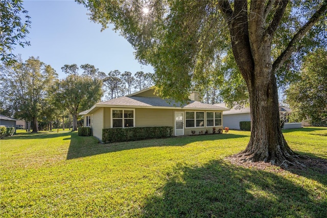 view of front of home with a front yard