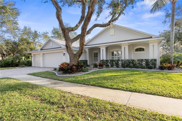 view of front of home featuring a garage and a front lawn