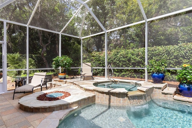 view of swimming pool with a patio area, an in ground hot tub, and glass enclosure