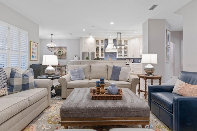 living room with a notable chandelier