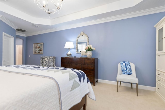 carpeted bedroom with crown molding, a tray ceiling, and a chandelier