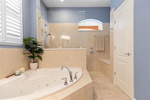 bathroom featuring plus walk in shower and tile patterned floors