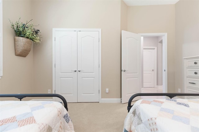 carpeted bedroom featuring a closet