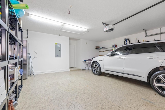 garage featuring electric panel and a garage door opener