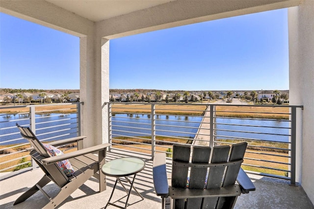 balcony featuring a water view