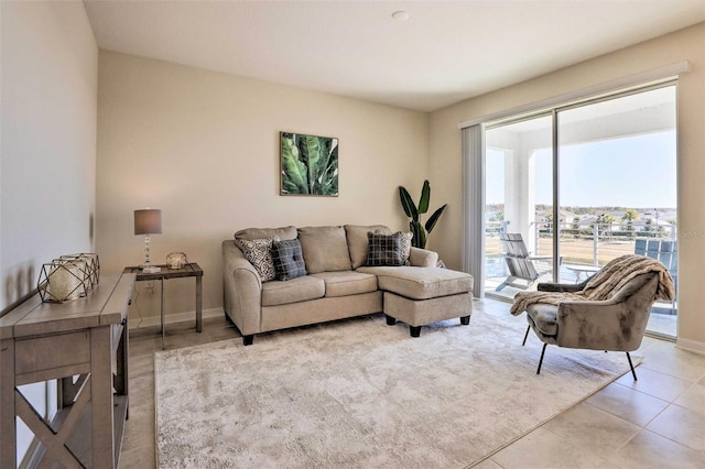 living room with plenty of natural light and light tile patterned floors