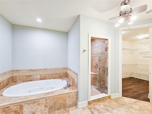 bathroom with tile patterned floors and plus walk in shower