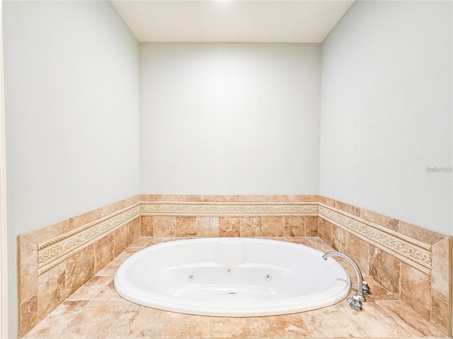 bathroom with tiled tub