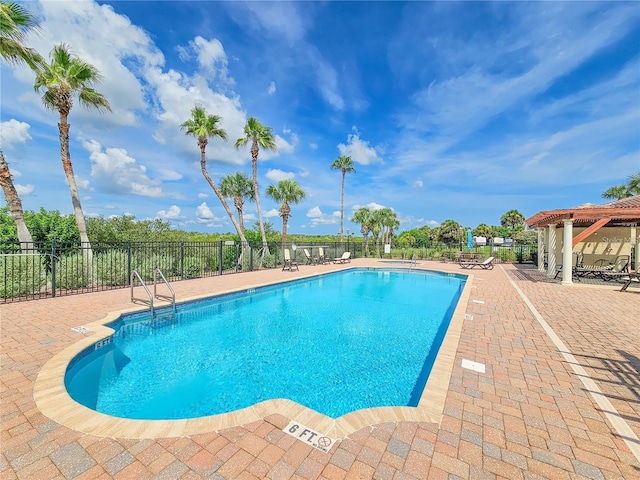 view of swimming pool with a patio area