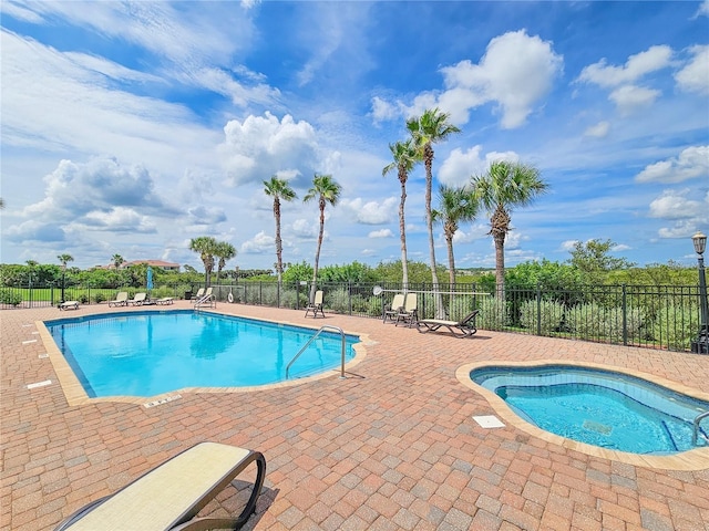 view of swimming pool featuring a patio area