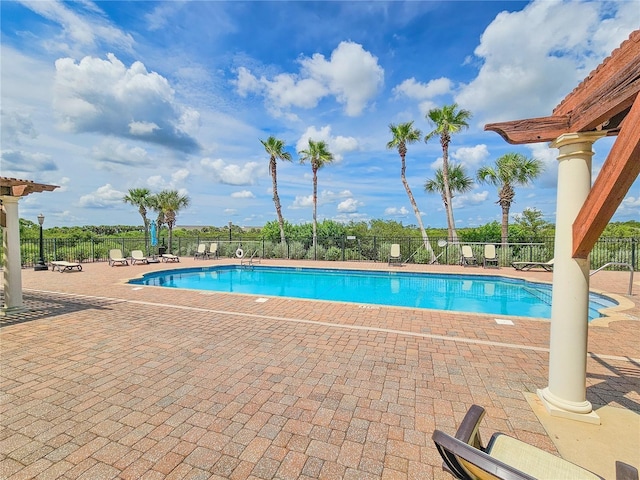 view of swimming pool featuring a patio area