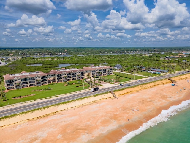 aerial view with a water view and a view of the beach