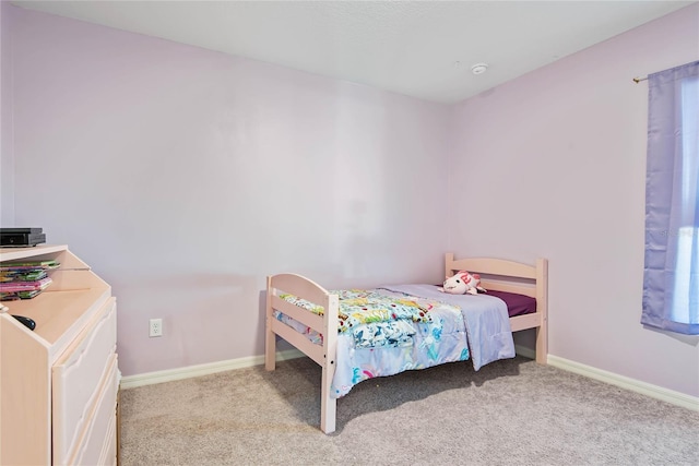 bedroom featuring light carpet