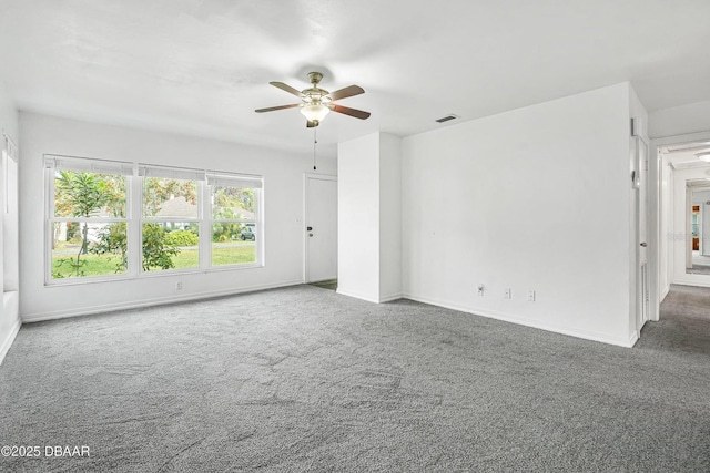 spare room featuring carpet flooring and ceiling fan