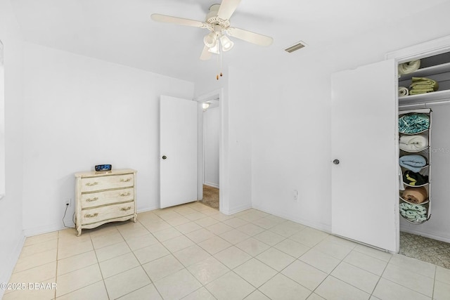 bedroom with ceiling fan and light tile patterned floors