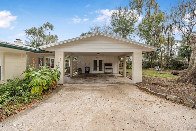 exterior space with a carport and french doors