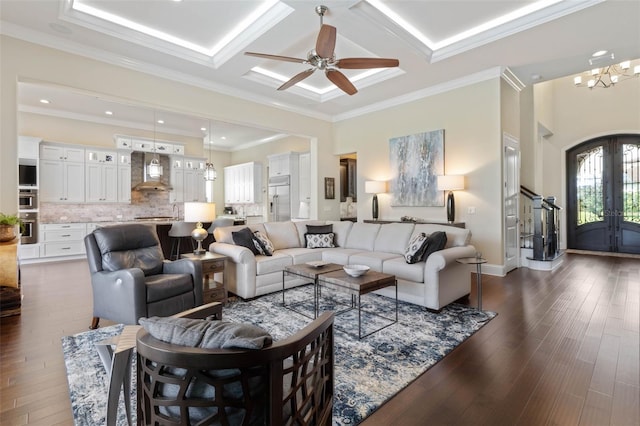 living room featuring crown molding, beam ceiling, dark hardwood / wood-style floors, coffered ceiling, and french doors