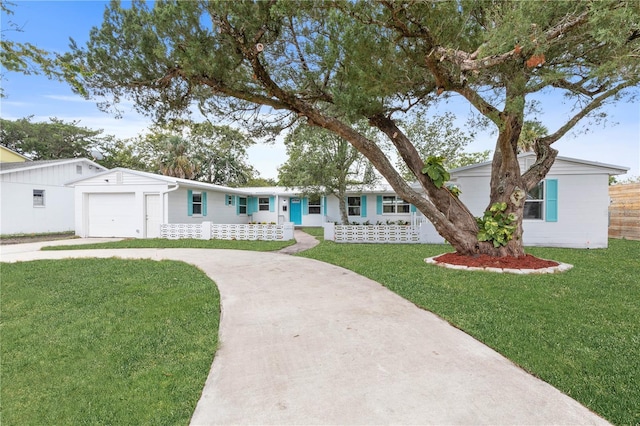 ranch-style house with a front yard and a garage