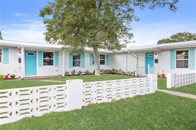 ranch-style home with a front yard