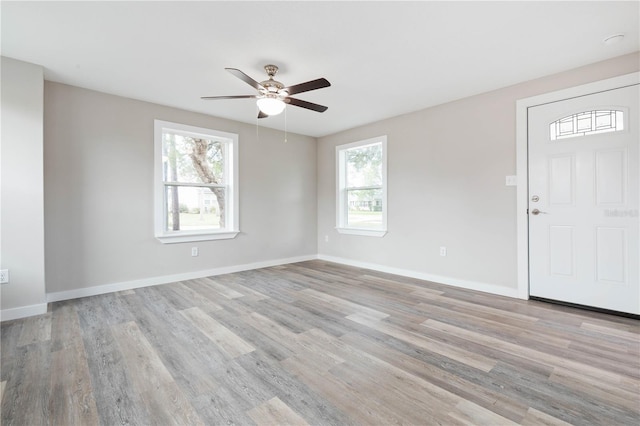 interior space featuring ceiling fan, plenty of natural light, and light hardwood / wood-style flooring