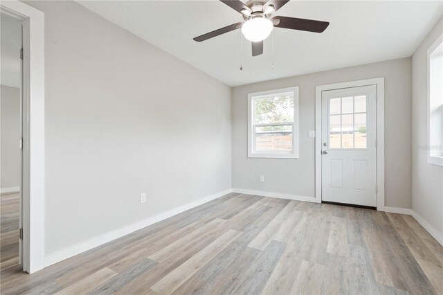 interior space with light hardwood / wood-style flooring and ceiling fan