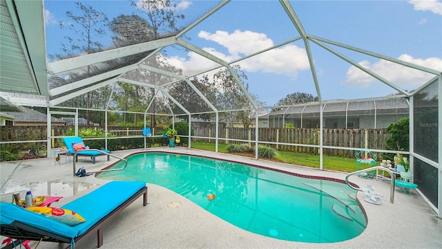 view of pool with a lanai and a patio area