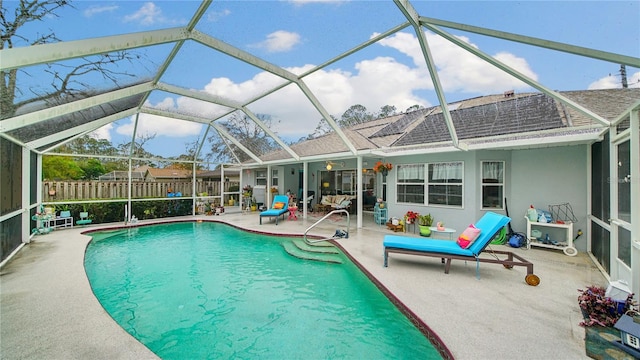 view of pool featuring a lanai and a patio