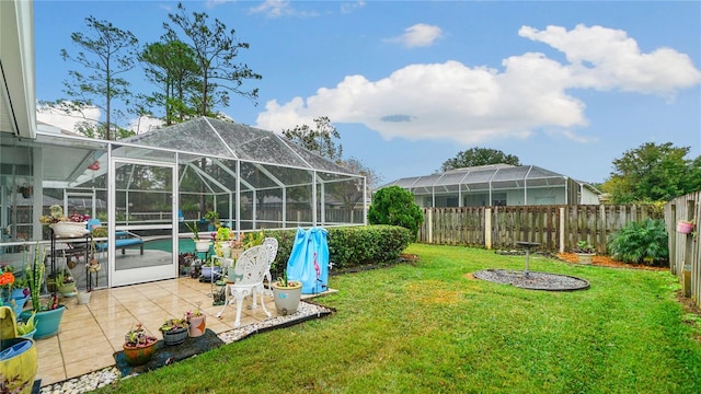 view of yard featuring a patio area and a lanai