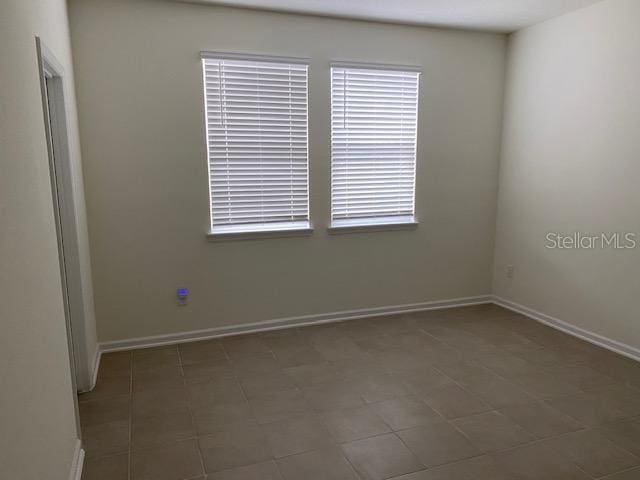 view of tiled spare room