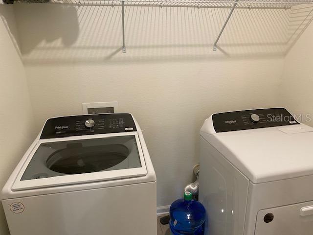 washroom featuring independent washer and dryer