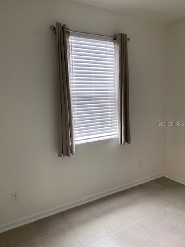 view of tiled empty room