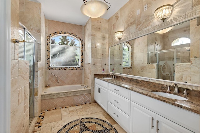 bathroom featuring vanity, tile walls, and plus walk in shower