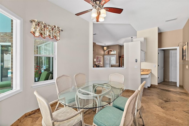 dining room with ceiling fan and a healthy amount of sunlight