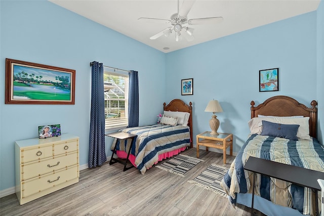 bedroom featuring light hardwood / wood-style flooring and ceiling fan