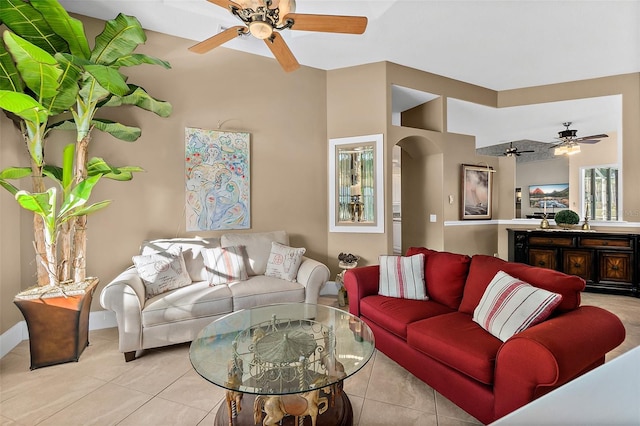 tiled living room with ceiling fan